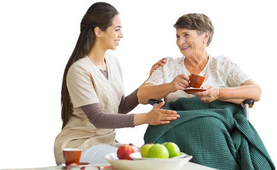 caregiver and senior woman drinking tea
